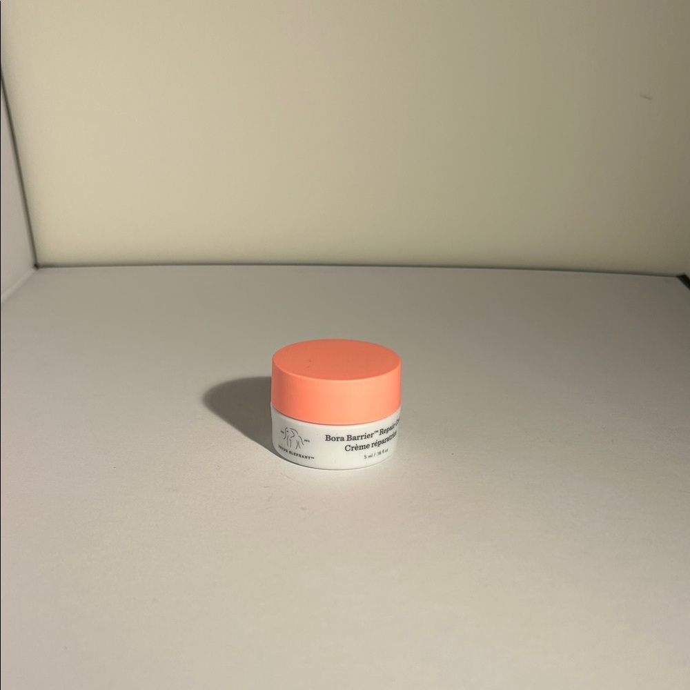 Drunk Elephant Vibrant Orange and White Moisturizer